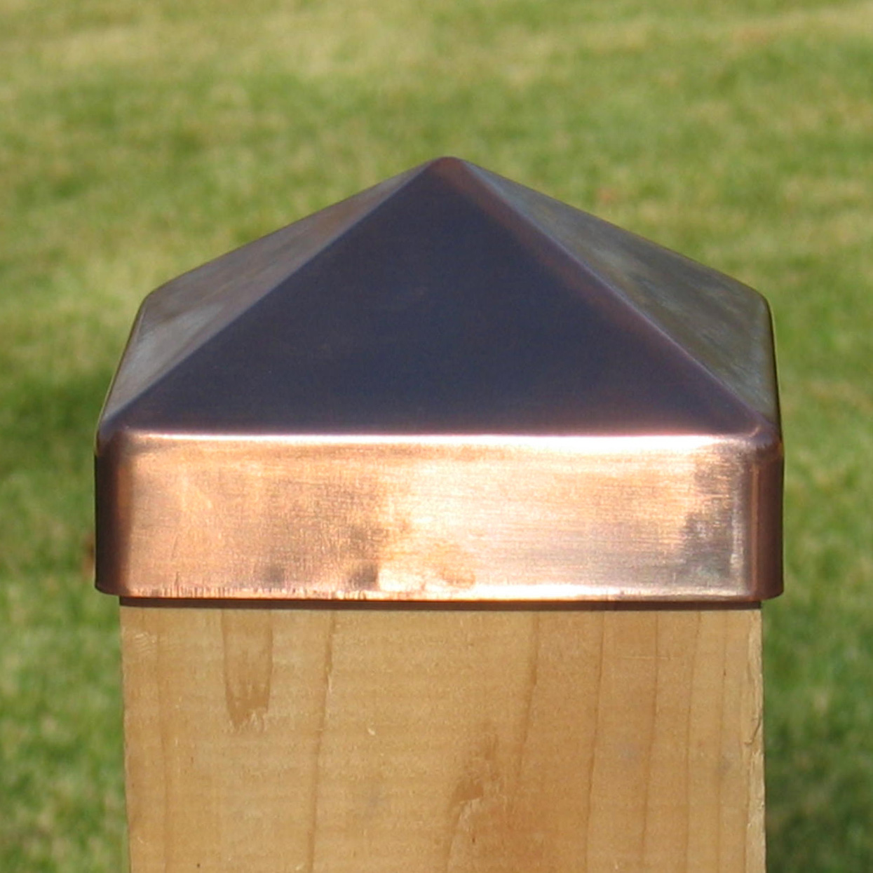 copper pyramid post caps on coastal redwood deck